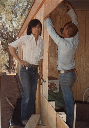 historical image of Steven Hirano doing construction