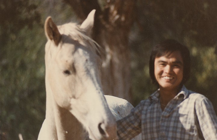 historical image of Steven Hirano with a white horse