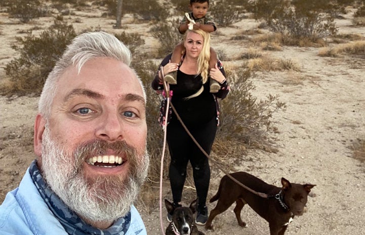 Scott taking a selfie with his family, including Summer Rain and Piney the dogs
