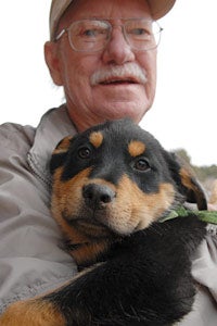 Don Bain holding a puppy 