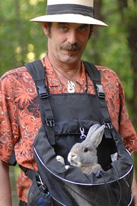 Man taking a rabbit for a walk in frontal backpack