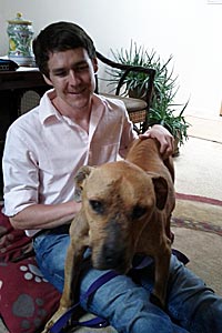 Best Friends' volunteer Zach Walker with Lucas the Vicktory dog (former Michael Vick dog)