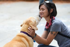 Blondie the dog interacting with a caregiver