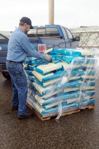 Man unloading the Blue Buffalo pet food donation in Detroit, Michigan