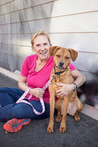 Cinnamon the dog with Angela her adopter