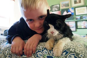 Dexter the 20-year-old cat and boy