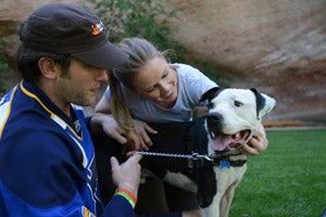 St. Louis Blues NHL player David Backes and wife, Kelly, with Vince the pit bull dog