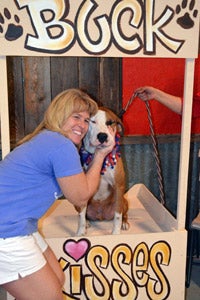 Tammy Dalton with a dog volunteering at an adoption event back home in Houston, Texas