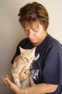Barbara gets a cuddle from a cat at Best Friends Animal Sanctuary
