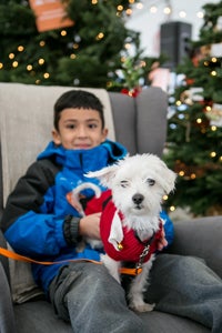 Armando Jr. wrote a letter to Santa asking for a dog. Here is Armando with Gaston the dog.