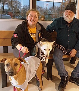 Heather and James Savee, their dog Leia, and Honey the shy Lab dog on the meet and greet at the shelter
