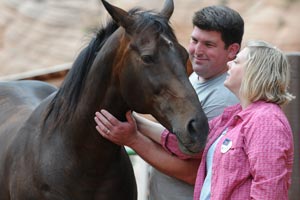 Volunteers Megan and Matt Claflin at Best Friends Animal Sanctuary with Lady the horse