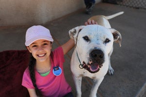 Girl named Kailey with Big Bob the pit bull