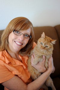 Holly Sizemore, Best Friends director of national programs, with an orange tabby cat