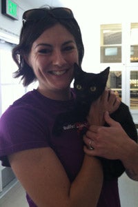 Suki the cat held by Stacy Sanders at Free Fix LA