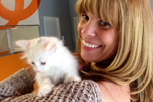 Sven the kitten with Kim who adopted him from the Best Friends Kitten Nursery