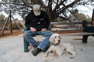 Volunteer dog transporter Bill Splitter with two dogs