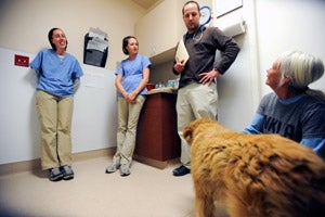 Veterinary students Amie Burling and Staci Cannon receiving instruction at the Best Friends animal clinic