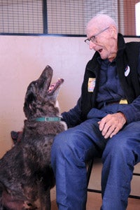 100-year-old volunteer Bill Philibert meeting a new friend