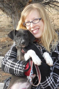 Vet tech student Elycia Degenhardt with Darla the puppy at Best Friends Animal Sanctuary