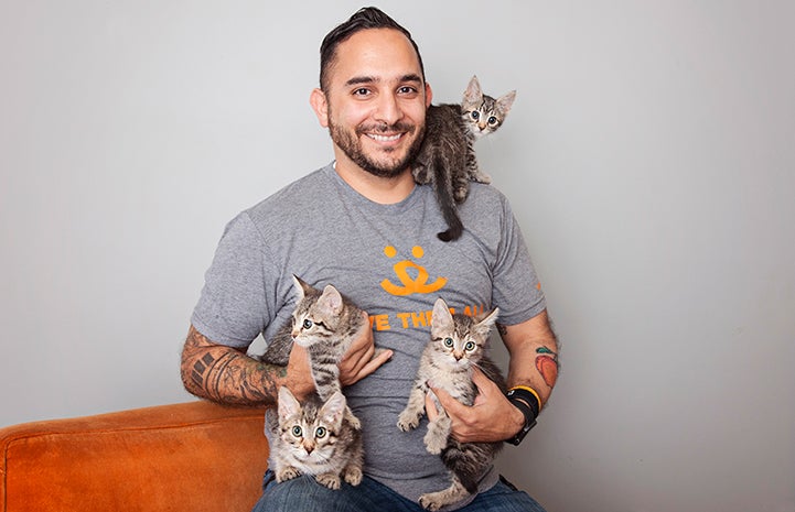 Marc Peralta, executive director of Best Friends–Los Angeles, plays with some adorable kittens