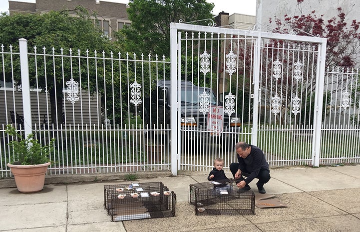 A caretaker tests out the traps while his grandson watches. This man and his wife trapped their whole colony of nine cats with Best Friends’ guidance.