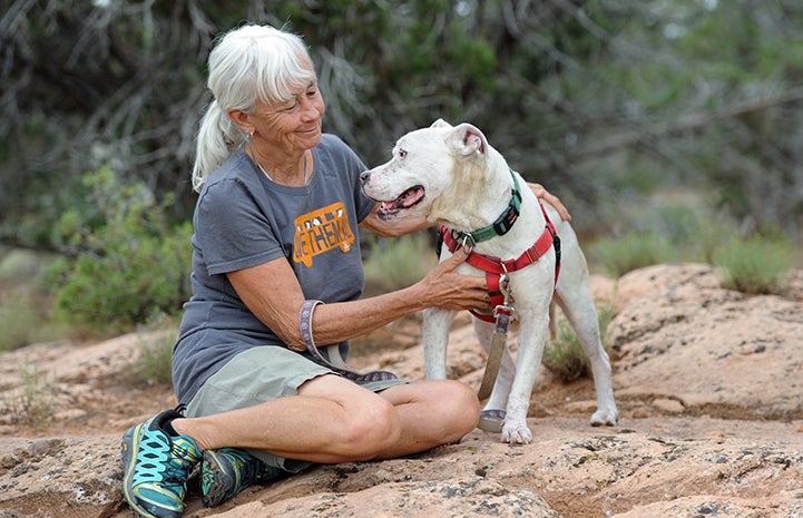 Pit bull terrier mix Destiny, who has canine lupus, with Deb Turner, the group coordinator for The Learning Experience