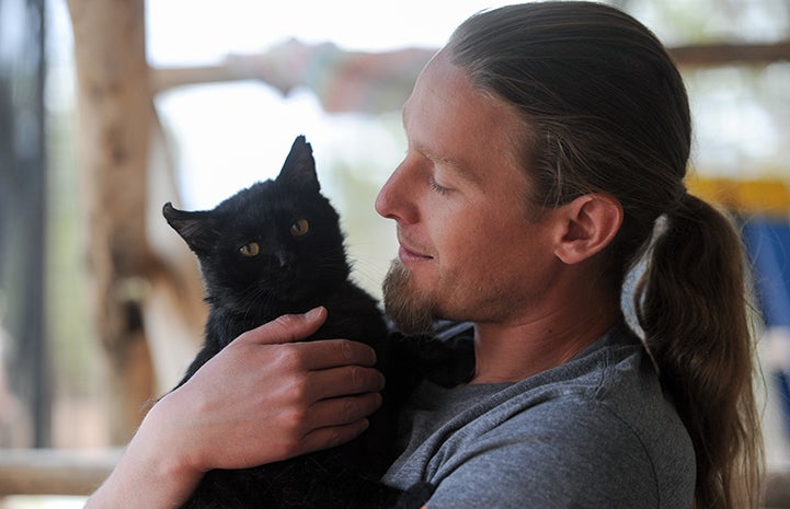 Levi Myers with Parker the cat