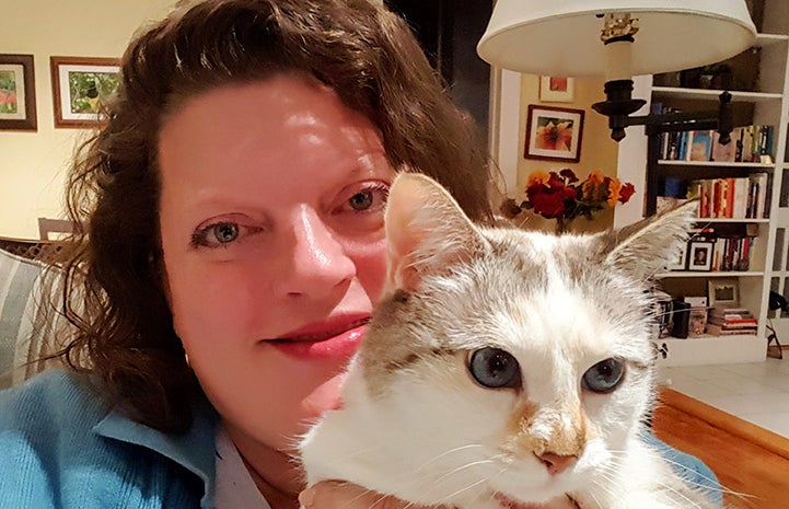 Google employee Karin Magnuson holding one of her cats