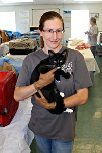 Dr. Carolyn Kenski, Best Friends community cat project coordinator, holding a cat who was spayed as part of TNR effort in Tucson, Arizona