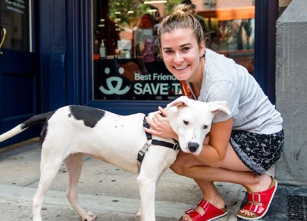 woman posing with her newly adopted dog