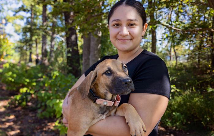Person holding a puppy at the Northwest Arkansas Super Adoption