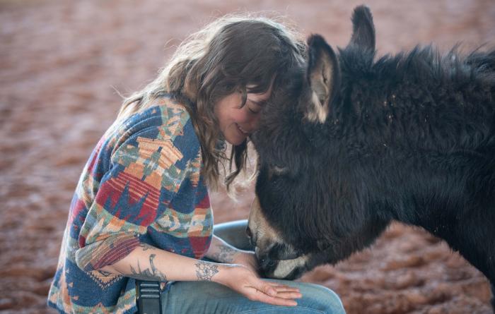 Shy cuddling with Annie the donkey