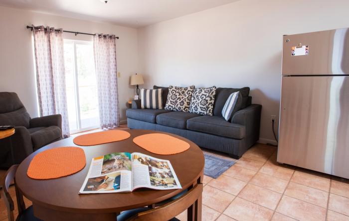 Interior photo of a Best Friends cottage with comfortable seating and a dining area