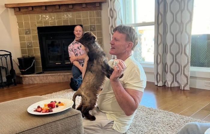 Volunteer Bill Coaker with Pepe the cat at home