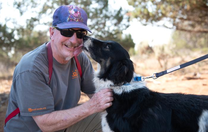 Sego the dog kissing Richard Garrett's face