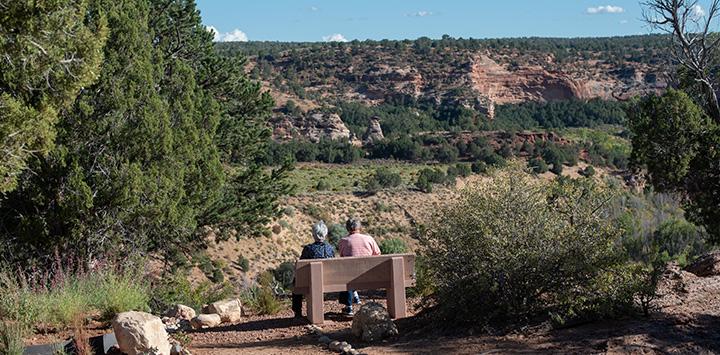 Couple sitting on a bench overlooking the canyon at the Best Friends Gratitude Garden