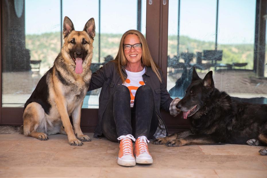 Best Friends Animal Society CEO Julie Castle with Sunny and Shadow, two German shepherds
