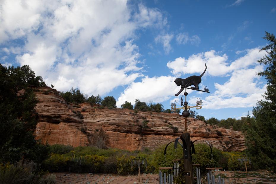 A view of Angles Rest in front of red rock cliffs and blue skies at Best Friends Animal Sanctuary