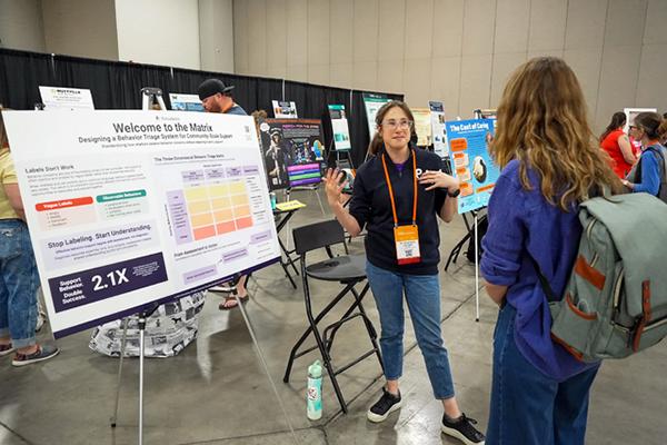 Best Friends National Conference research poster with two people talking