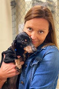 Becca Boronat, MV, CAWA holding a senior dachshund