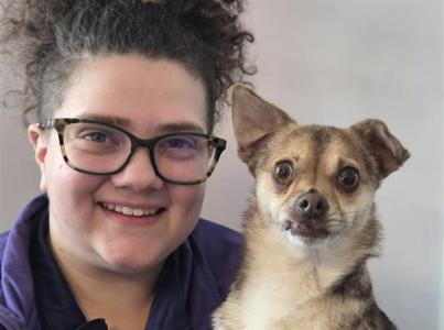 Karlie Repp with a small brown dog