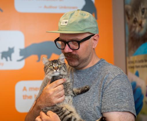 Person holding a kitten at Best Friends in Salt Lake City