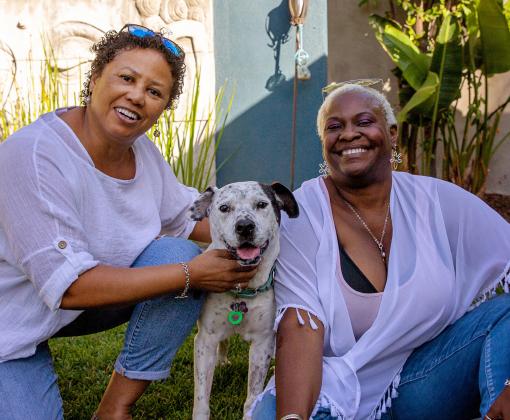 Two women with a dog