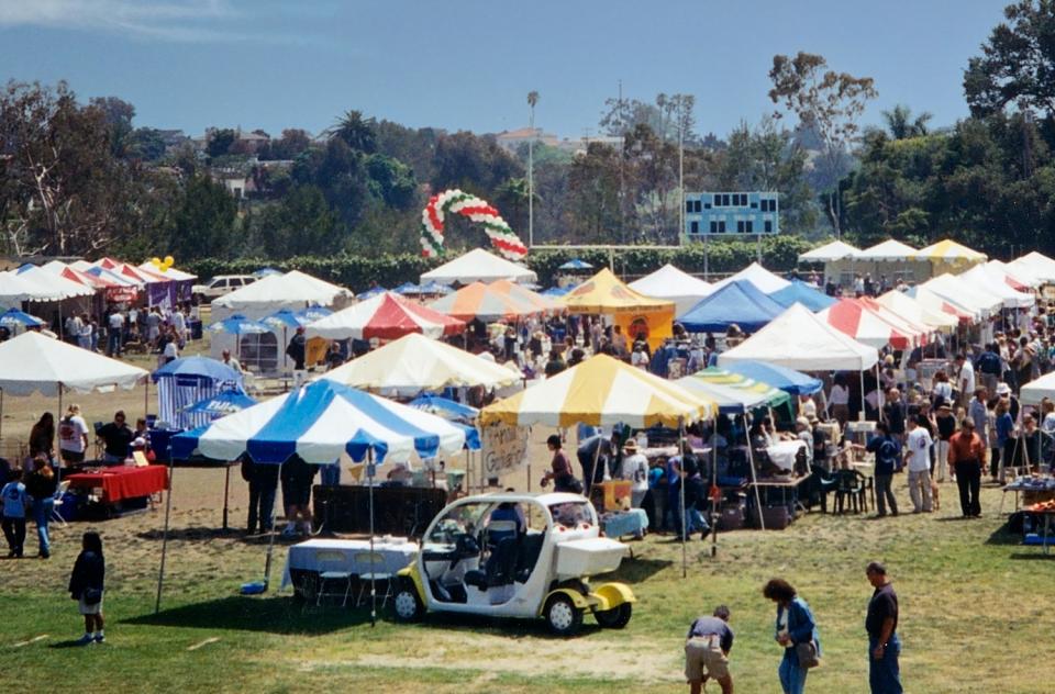 Outdoor festival with colorful tents