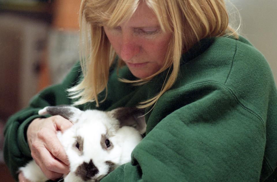 Chandra Forsythe holding a rabbit