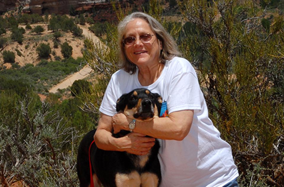 Co-founder Claire Ives hugging a dog