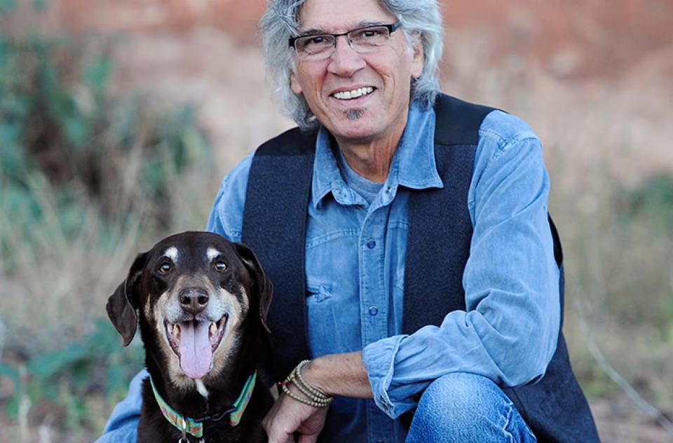 Cyrus Mejia beside a dog