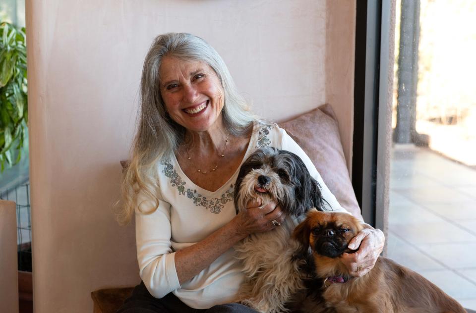 Jana de Peyer with two small dogs