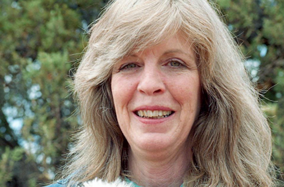 Best Friends co-founder Magdalen Eckhoff with a small white dog